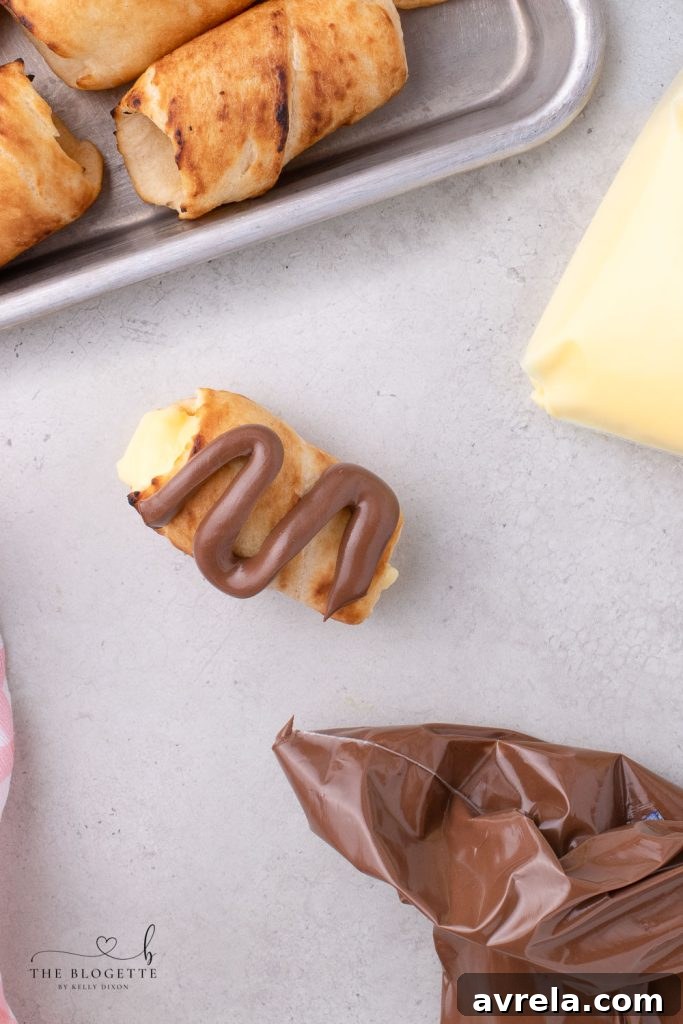 Fireside Eclairs 9 Finished campfire eclair with pudding and Nutella