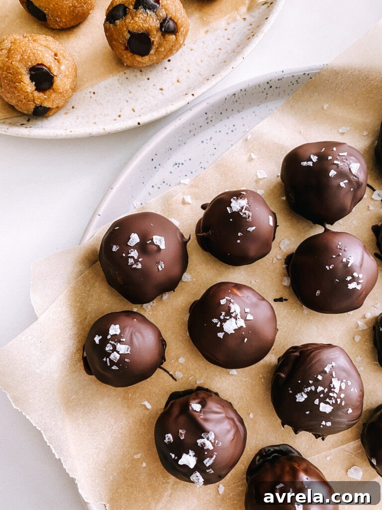 Delicious healthy chocolate covered cookie dough bites on parchment paper