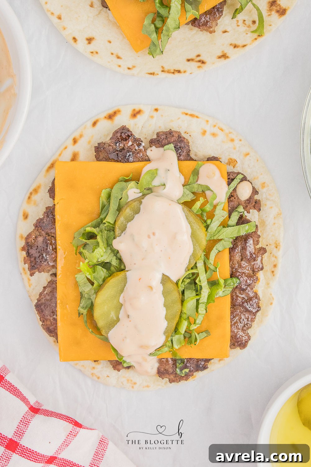 Double-Decker Taco 9 Big Mac Tacos! Juicy beef patty, melted cheddar, topped with an easy-to-make homemade Big Mac sauce! Add Taco Burgers to your menu tonight!