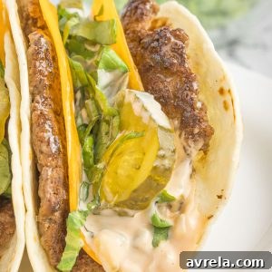 Double-Decker Taco 11 Big Mac Tacos! Juicy beef patty, melted cheddar, topped with an easy-to-make homemade Big Mac sauce! Add Taco Burgers to your menu tonight!