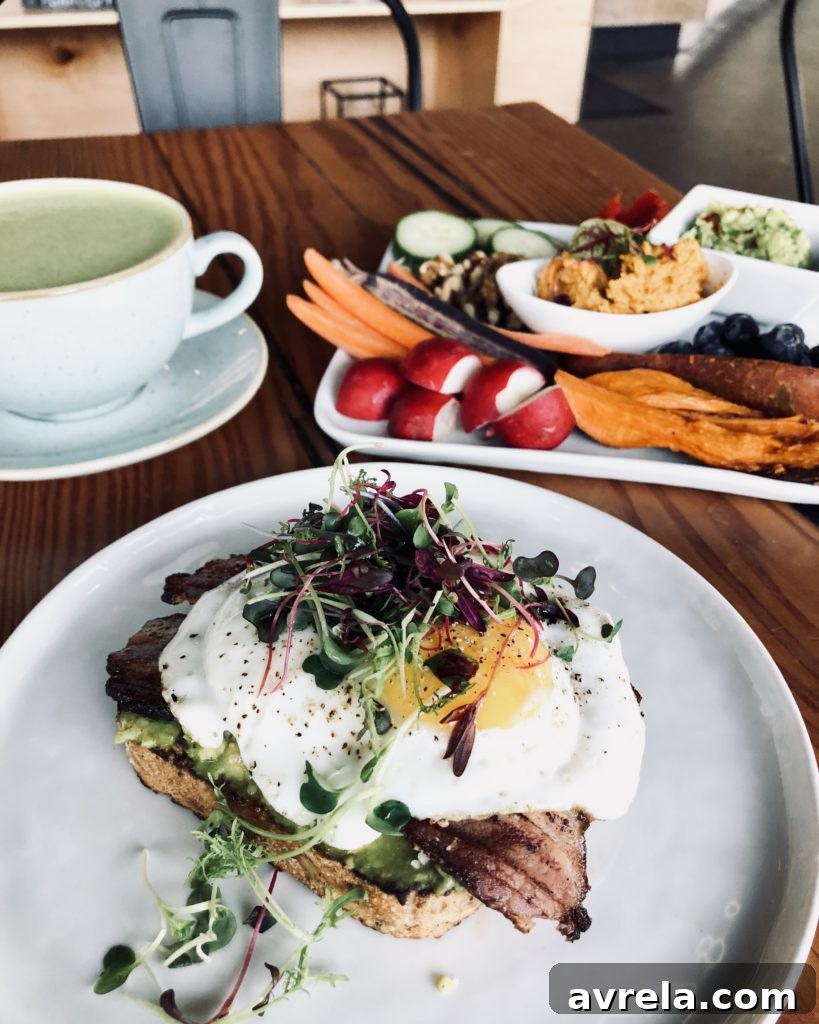 Matcha latte, raw fruit & veggies plate, and avocado toast at Retreat Coffee