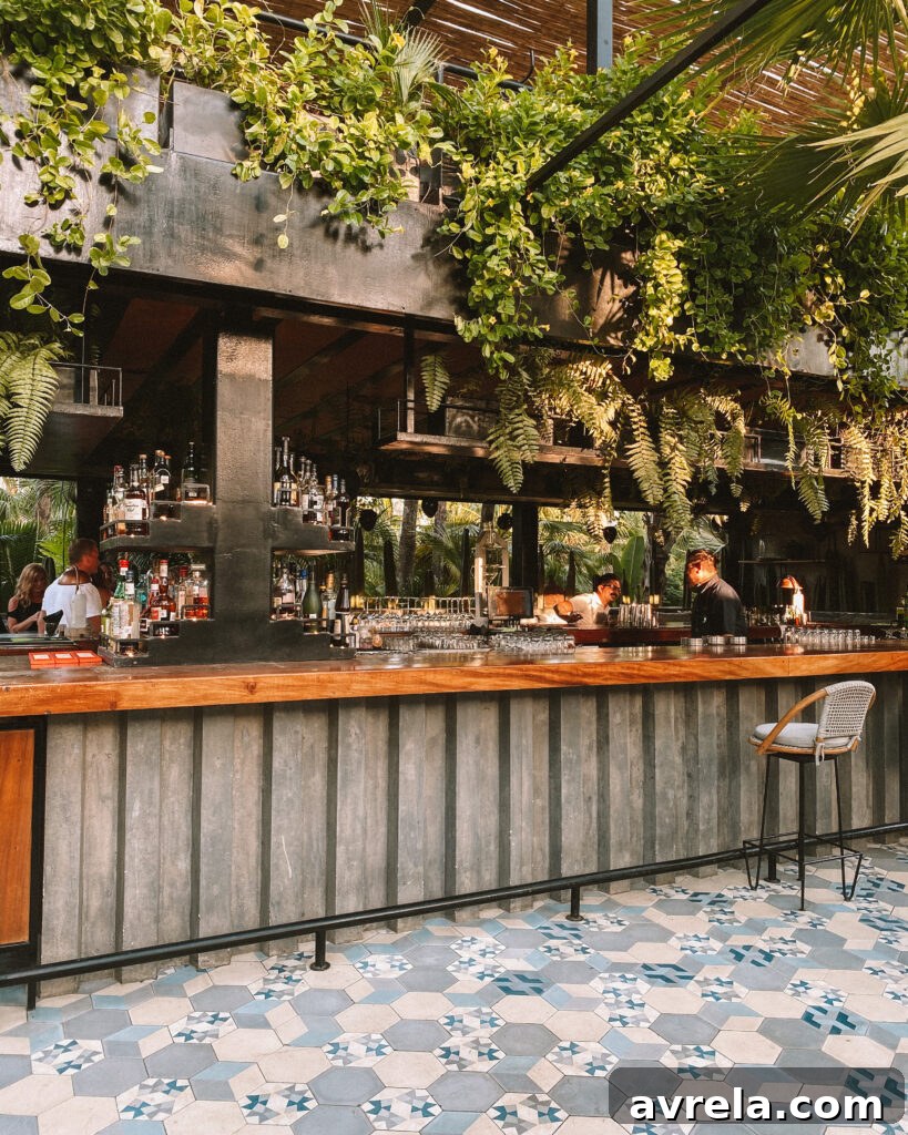 Couple posing for a photo at Acre Baja with vibrant foliage