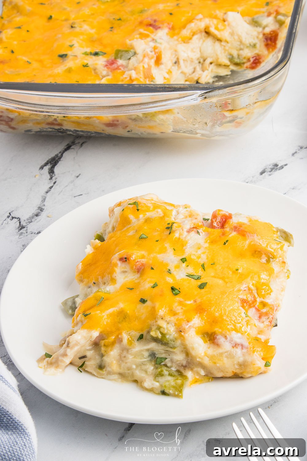 King Ranch Chicken Casserole is a combination of chicken, cheese, veggies, and corn tortillas in a rich and creamy sauce.