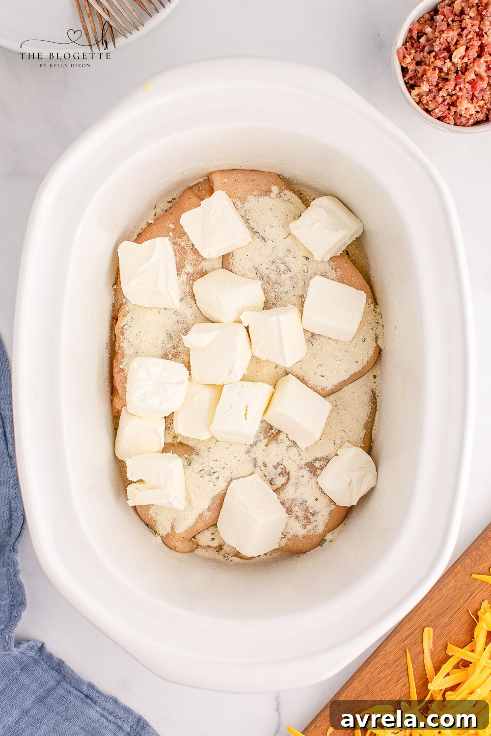 Effortless Cheesy Slow Cooker Chicken 6 Cream cheese, ranch mix, chicken