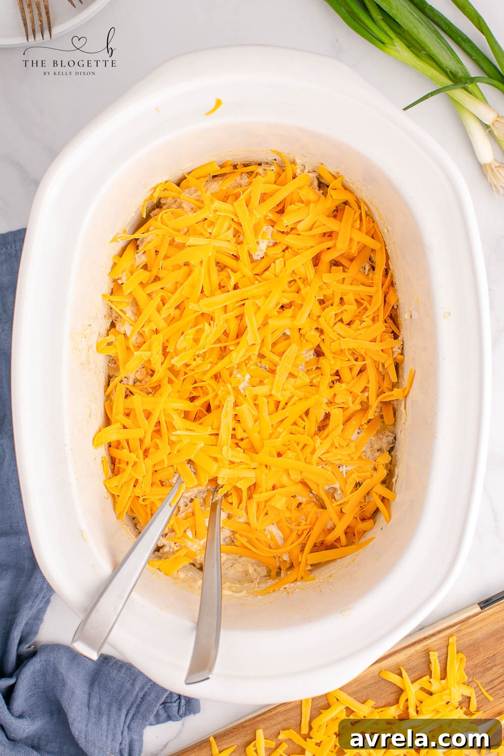 Effortless Cheesy Slow Cooker Chicken 8 Cheese over chicken in slow cooker