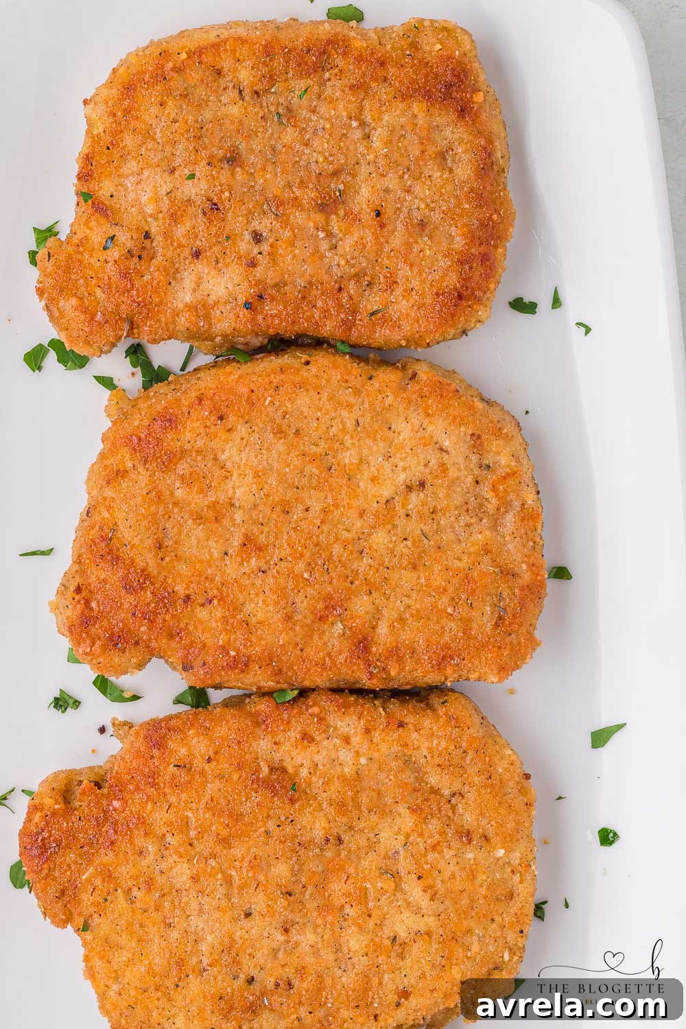 Breaded Fried Pork Chops cooked to crispy perfection! Golden brown boneless pork chops are crispy on the outside and juicy on the inside.