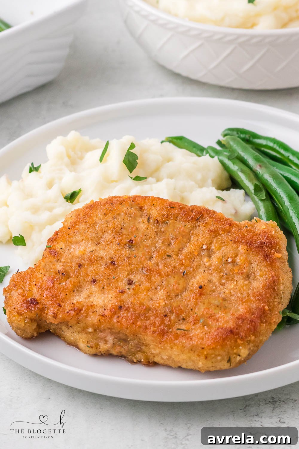Breaded Fried Pork Chops cooked to crispy perfection! Golden brown boneless pork chops are crispy on the outside and juicy on the inside.