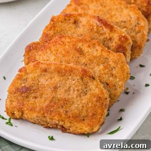 Breaded Fried Pork Chops cooked to crispy perfection! Golden brown boneless pork chops are crispy on the outside and juicy on the inside.