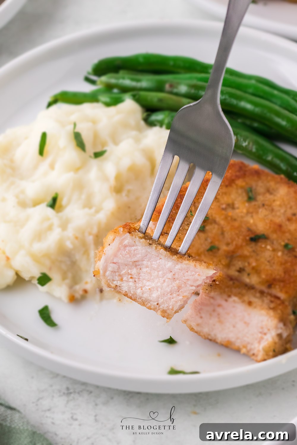 Breaded Fried Pork Chops cooked to crispy perfection! Golden brown boneless pork chops are crispy on the outside and juicy on the inside.