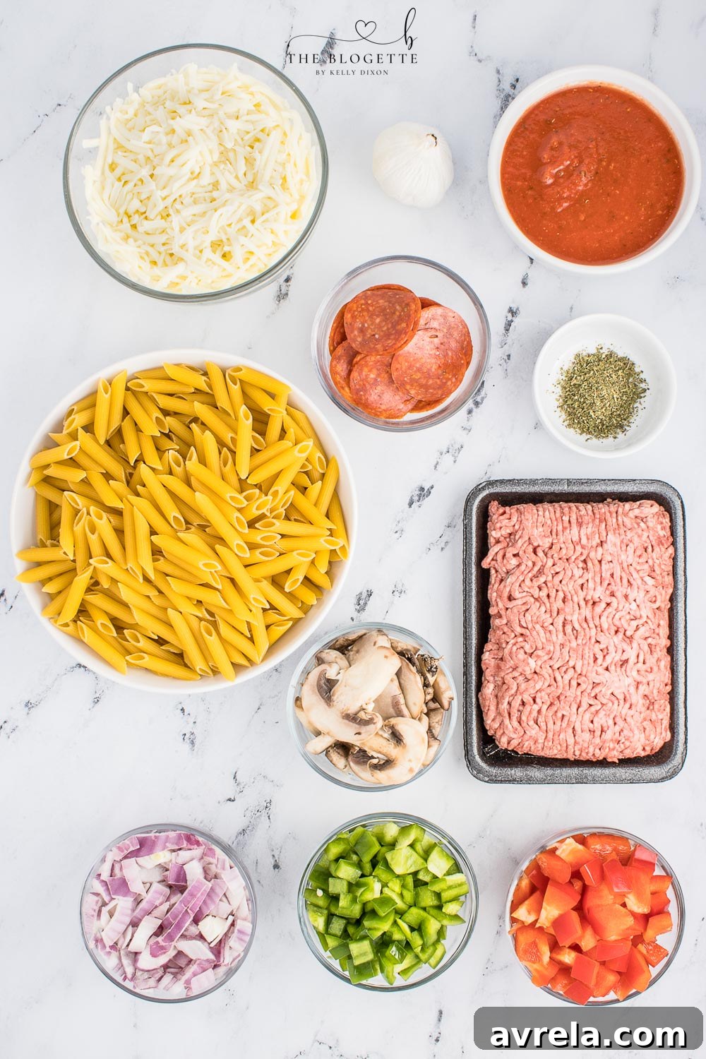Ingredients for a homemade pizza casserole laid out on a kitchen counter.