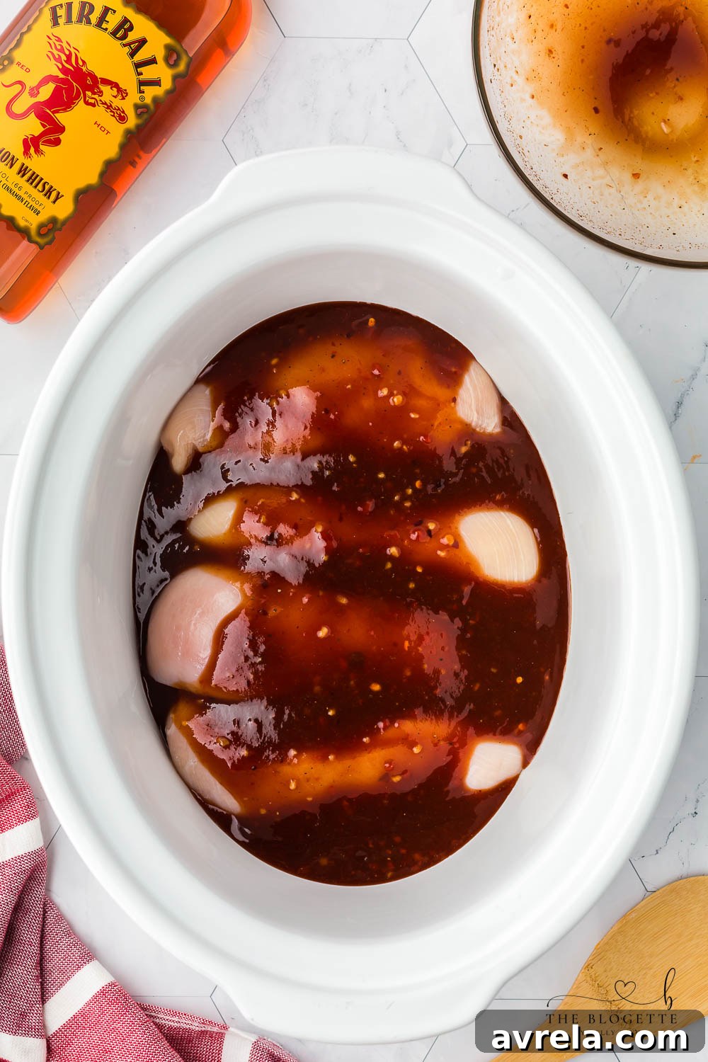 Fiery Cinnamon Crockpot Chicken 7 Sauce over chicken in crock pot