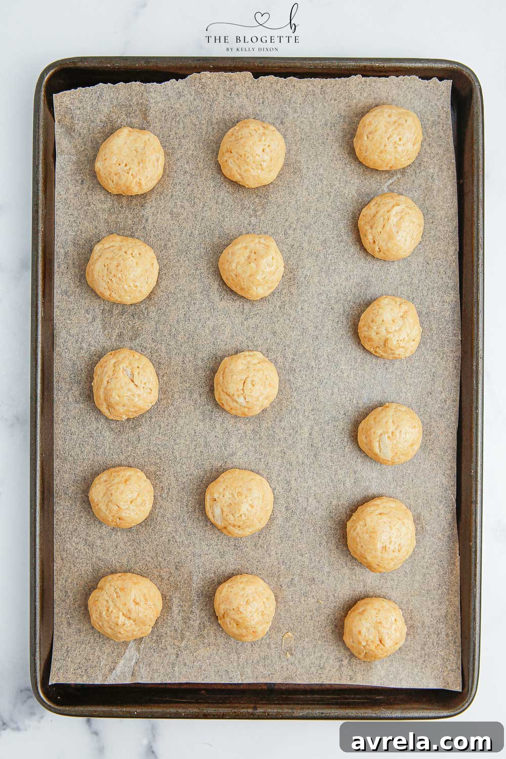 Chilled truffle balls waiting to be dipped in white chocolate. They are perfectly round and firm.