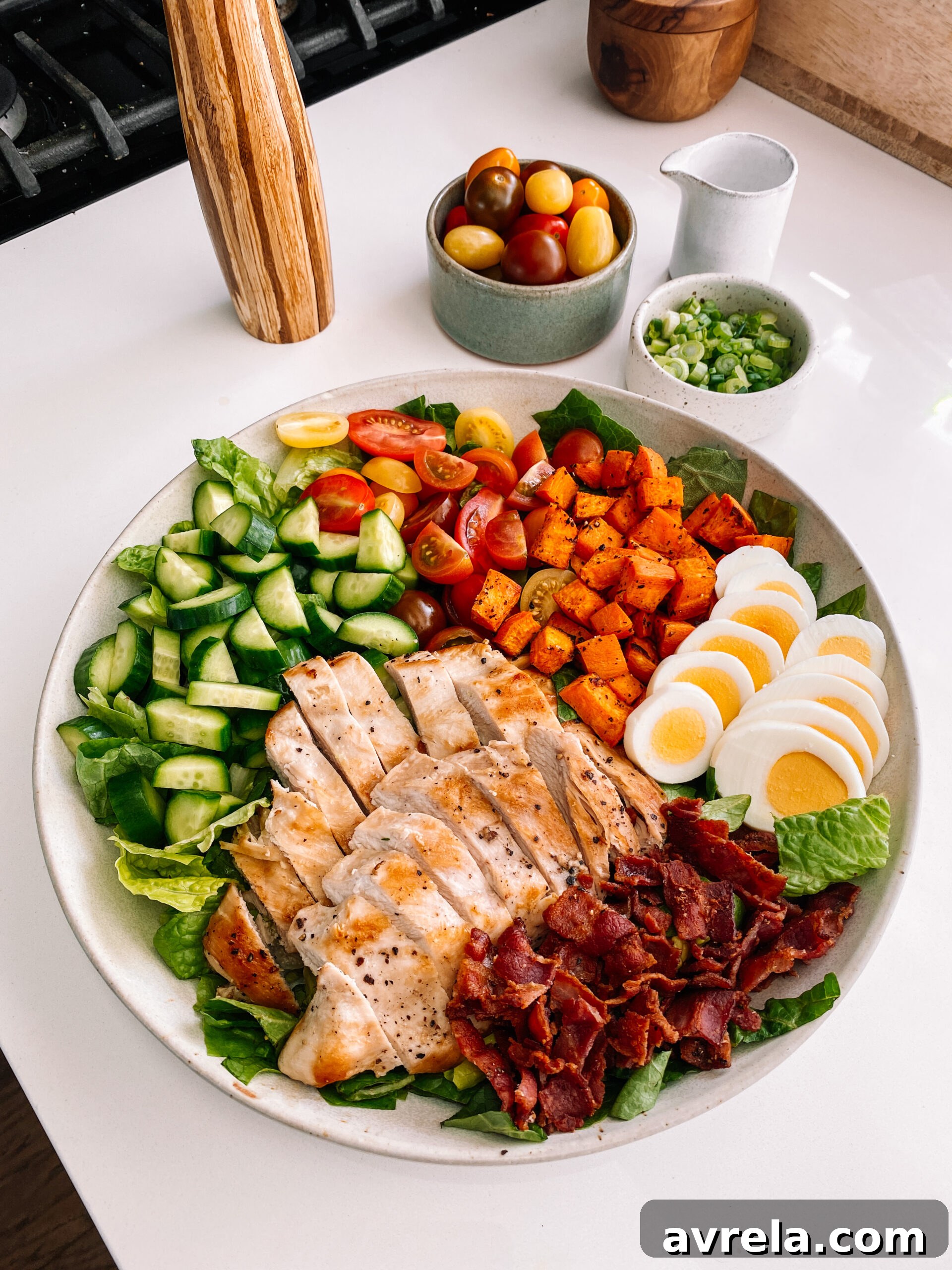 Delicious RGE Cobb Salad with chicken, sweet potato, bacon, and fresh vegetables