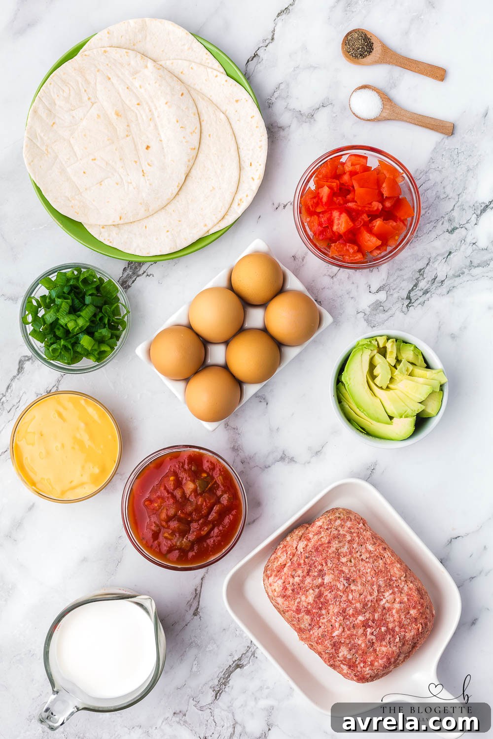 Morning Fiesta Tacos 4 All the fresh ingredients laid out for making breakfast tacos: eggs, sausage, avocado, tomatoes, onions, and salsa.
