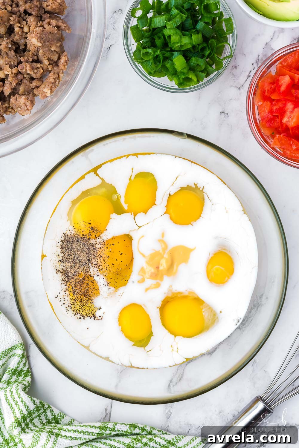 Morning Fiesta Tacos 7 Whisked egg mixture with salsa con queso and milk in a bowl.