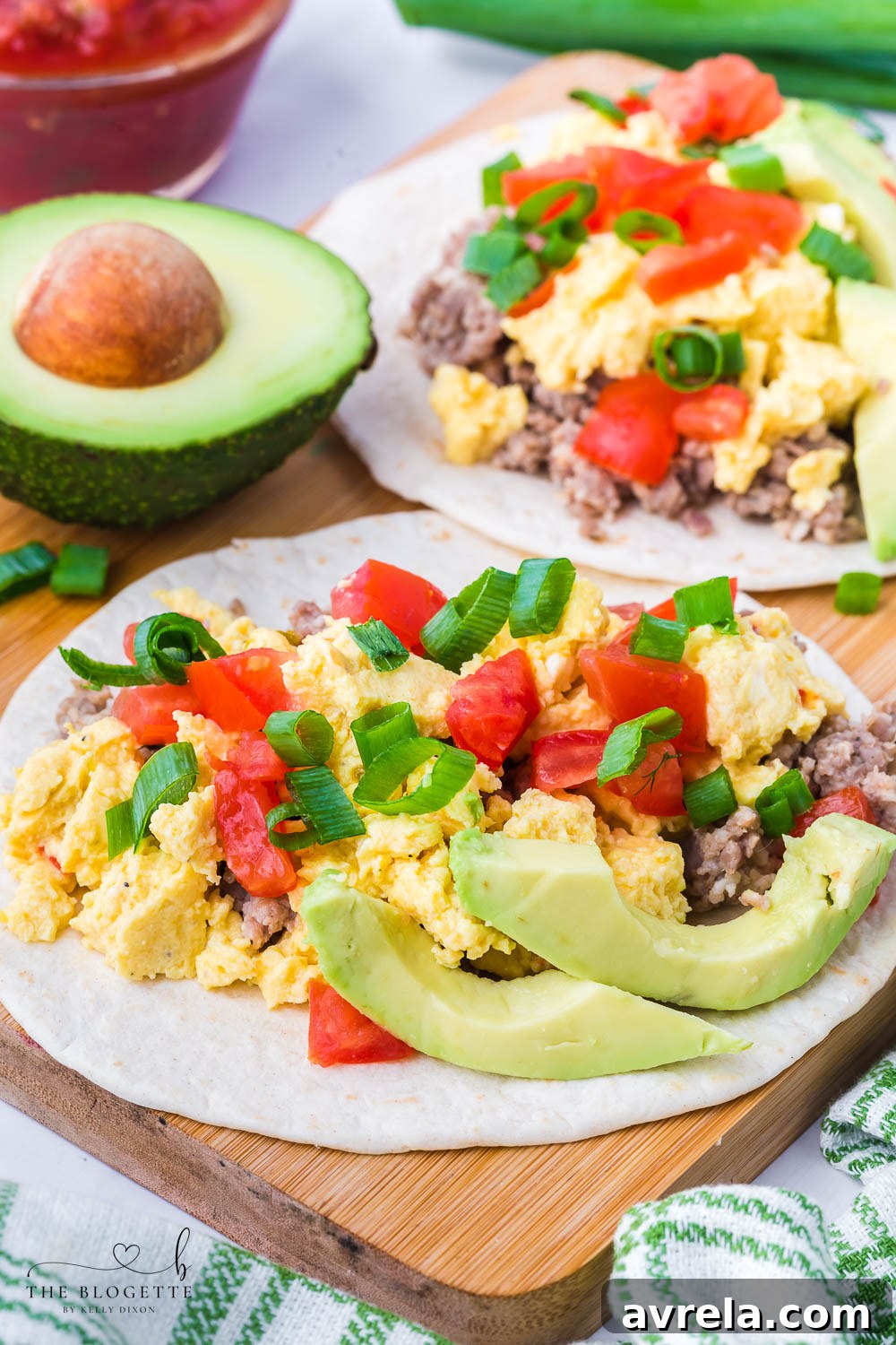 Morning Fiesta Tacos 9 Finished breakfast tacos garnished with fresh avocado and green onions.