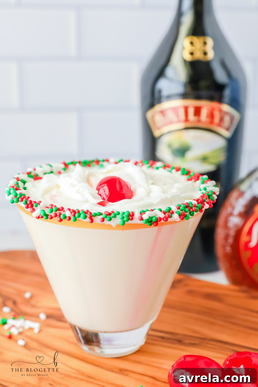Frosted Sugar Dream 11 A sugar cookie cocktail for Christmas! Vanilla-rimmed martini glass filled with whipped cream vodka, Irish Cream, and Amaretto, garnished with whipped cream and a cherry.