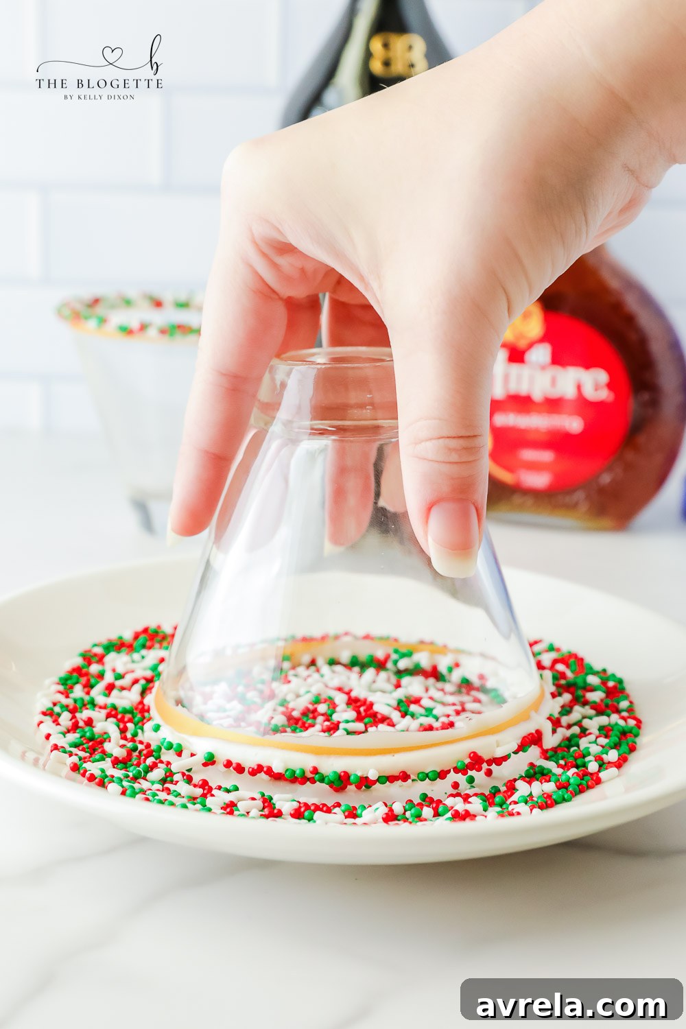 Frosted Sugar Dream 6 Adding festive sprinkles to the frosting-rimmed cocktail glass