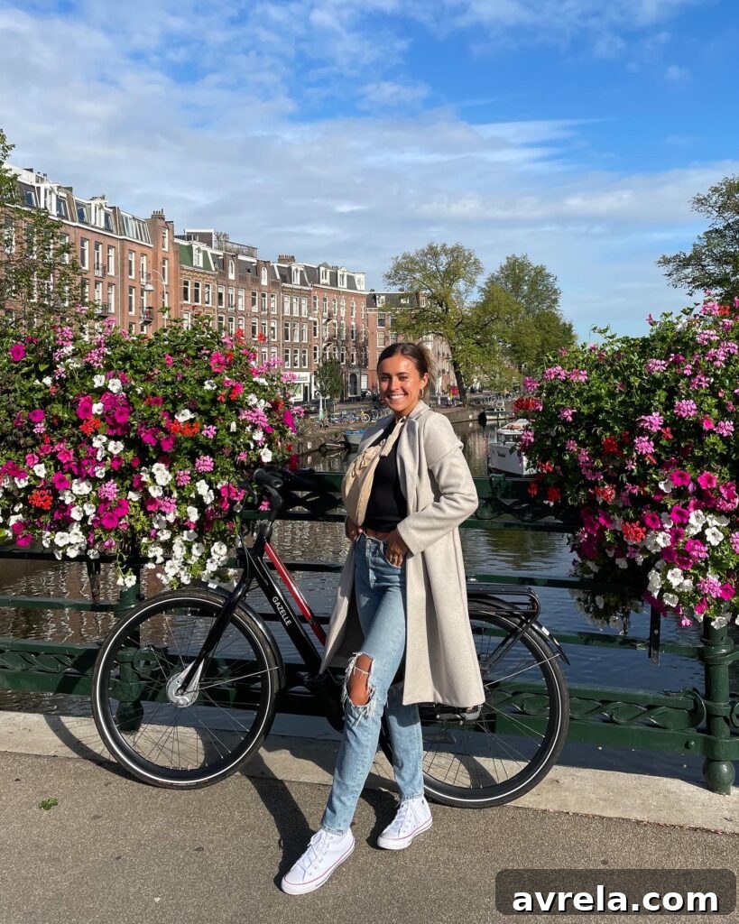 Picturesque canal in Amsterdam with historic buildings and bicycles.
