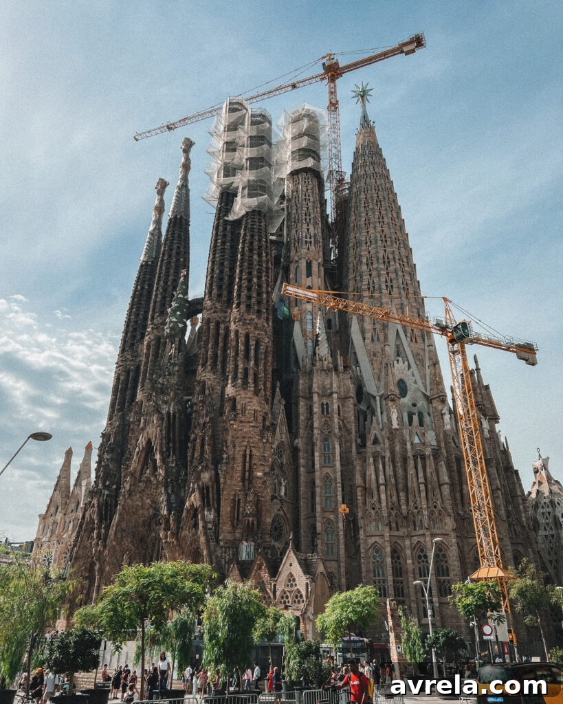 Close-up of the Nativity Facade of La Sagrada Familia, richly decorated with intricate carvings depicting scenes from the birth of Jesus.