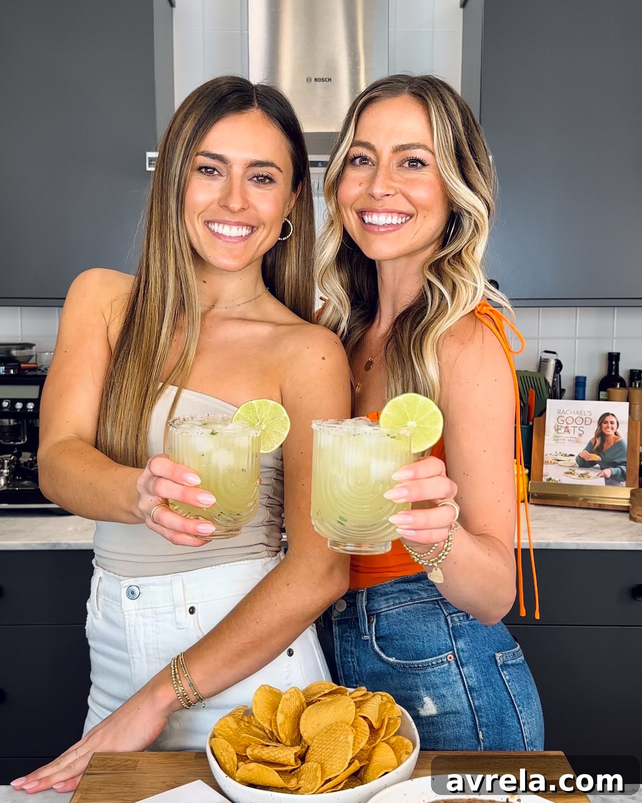 A vibrant Pineapple Mezcalita cocktail garnished with pineapple, jalapeño, and a salted rim.