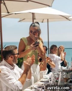 Author sharing a joyful interaction with a guest, surrounded by a celebratory atmosphere.