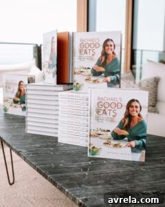 A table laden with multiple copies of the RGE cookbook, ready for signing.