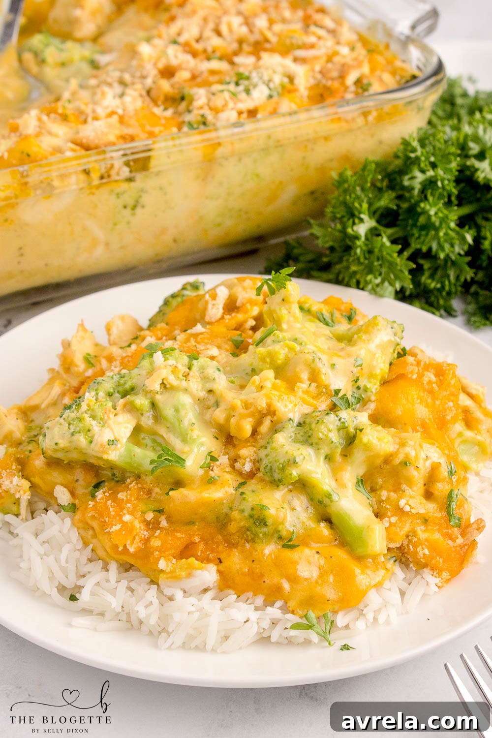 A close-up of Chicken Divan showing the rich, creamy sauce, tender chicken, and vibrant broccoli florets before being baked.