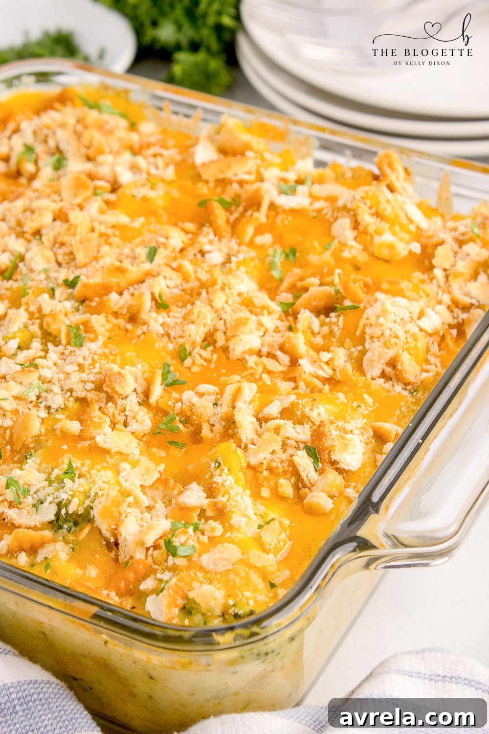 A golden-brown Chicken Divan casserole, fresh from the oven, topped with crispy Ritz crackers and bubbly cheese.