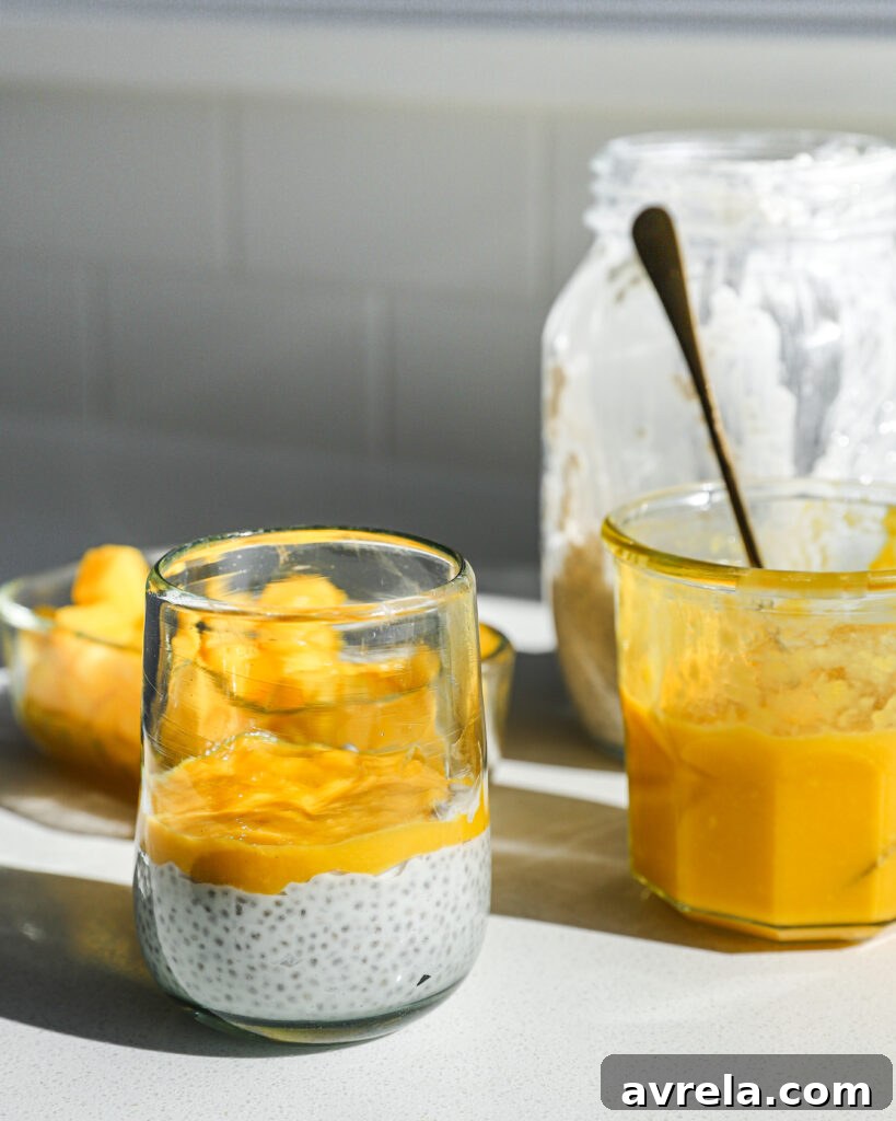 Tropical Mango Coconut Chia Bliss 3 Freshly blended mango puree being poured into a jar.