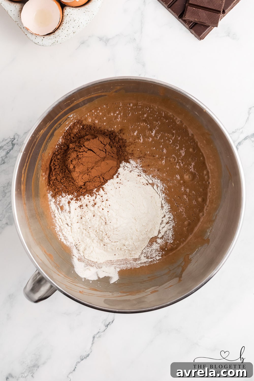 Thick, glossy brownie mixture ready for baking.