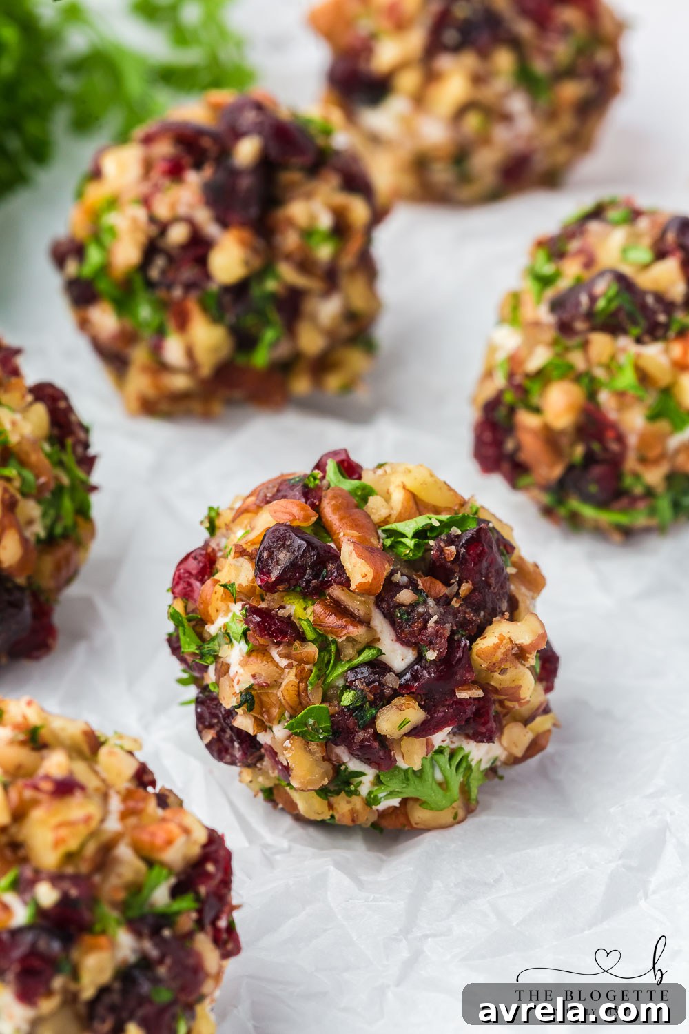 A festive holiday spread featuring Cranberry Pecan Goat Cheese Balls alongside other appetizers, perfect for entertaining.