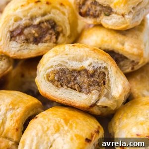 Appetizer sausage rolls feature a meaty mixture stuffed inside buttery soft puff pastry. An easy crowd-pleasing handheld party appetizer!