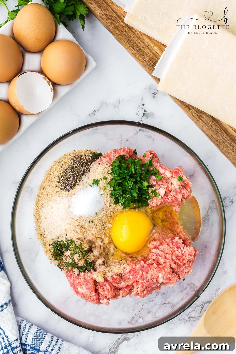 Prepared raw meat mixture ready to be placed into puff pastry for sausage rolls.