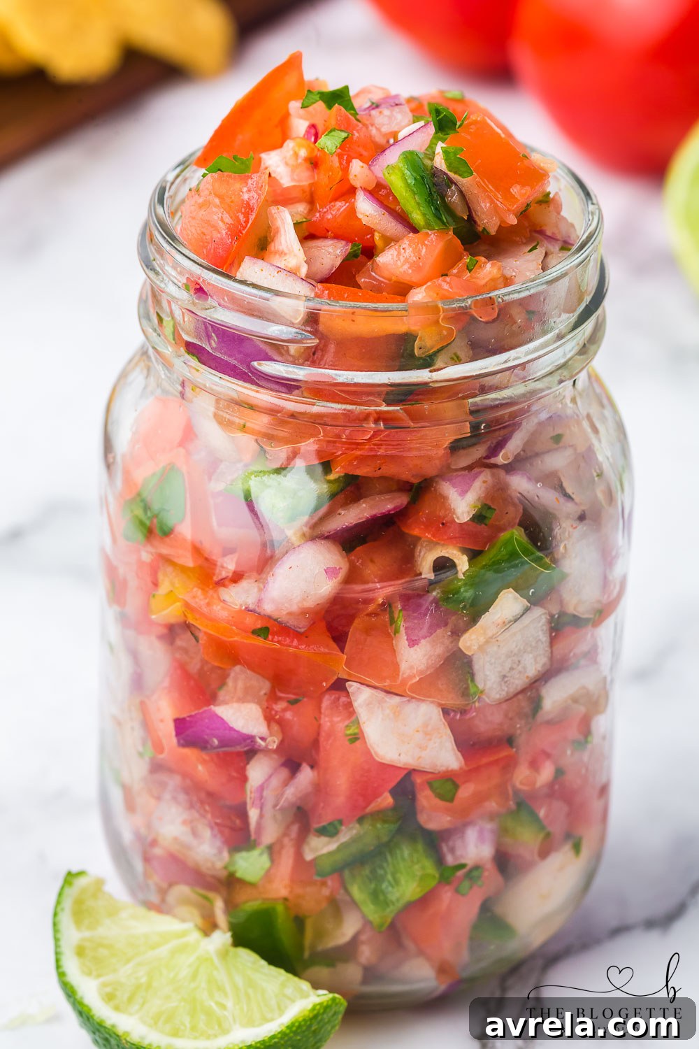 Homemade Pico de Gallo, a fresh and easy salsa recipe featuring diced tomatoes, jalapeños, onions, and cilantro.