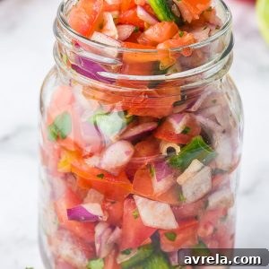 Homemade Pico de Gallo is so fresh and easy to make! Featuring fresh tomatoes, jalapeños, onions, cilantro, and more.