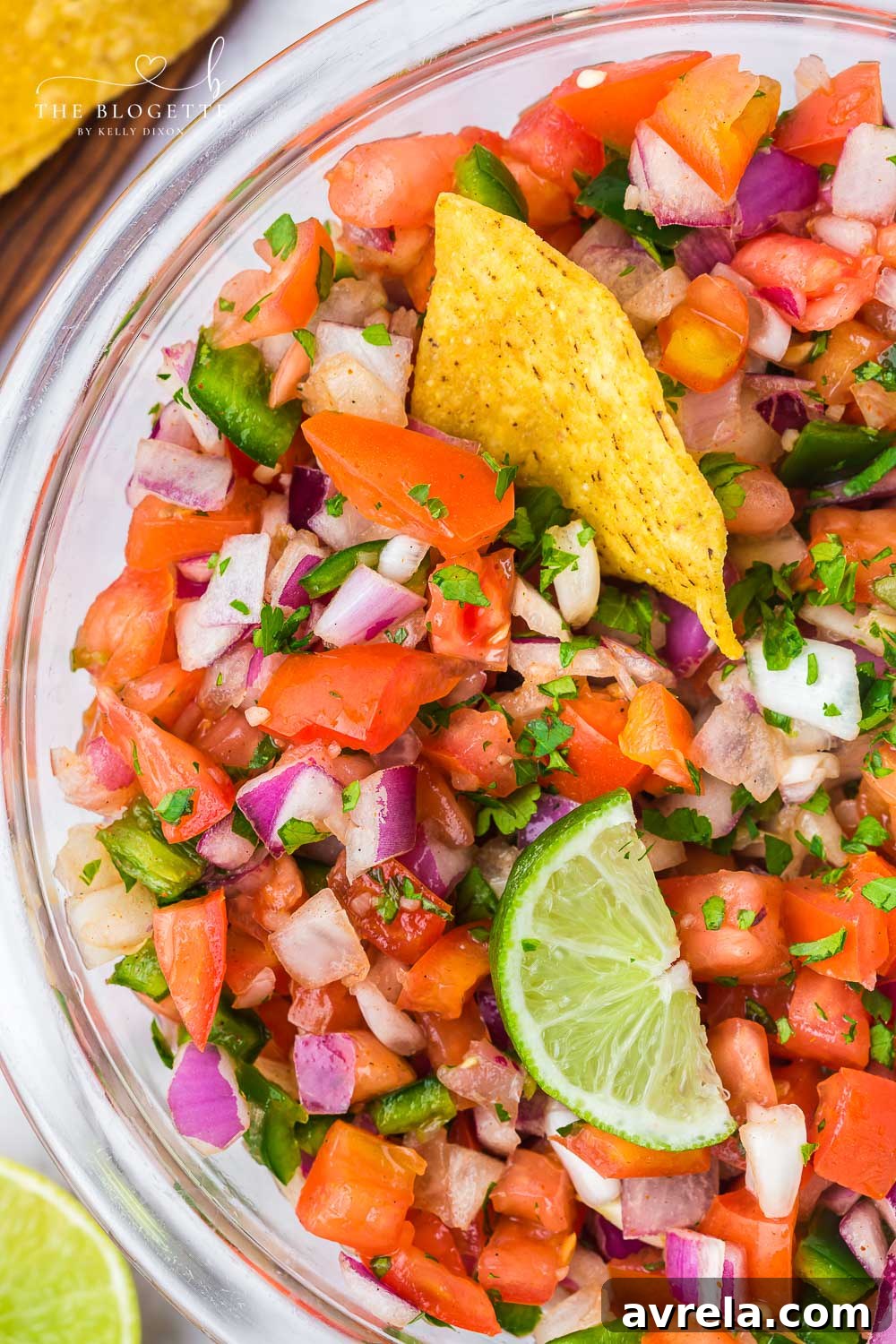 A vibrant bowl of homemade Pico de Gallo, showcasing its fresh and colorful ingredients.
