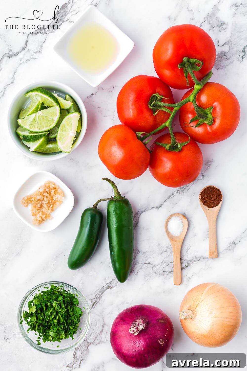 A selection of fresh ingredients including tomatoes, jalapeños, and onions, ready for making Pico de Gallo.
