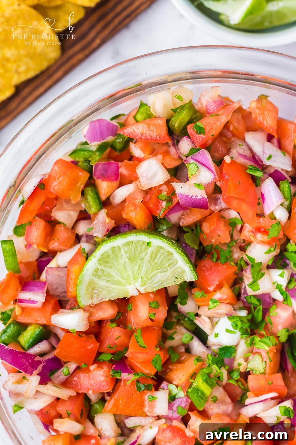 A serving bowl filled with fresh homemade Pico de Gallo, ready to be enjoyed.