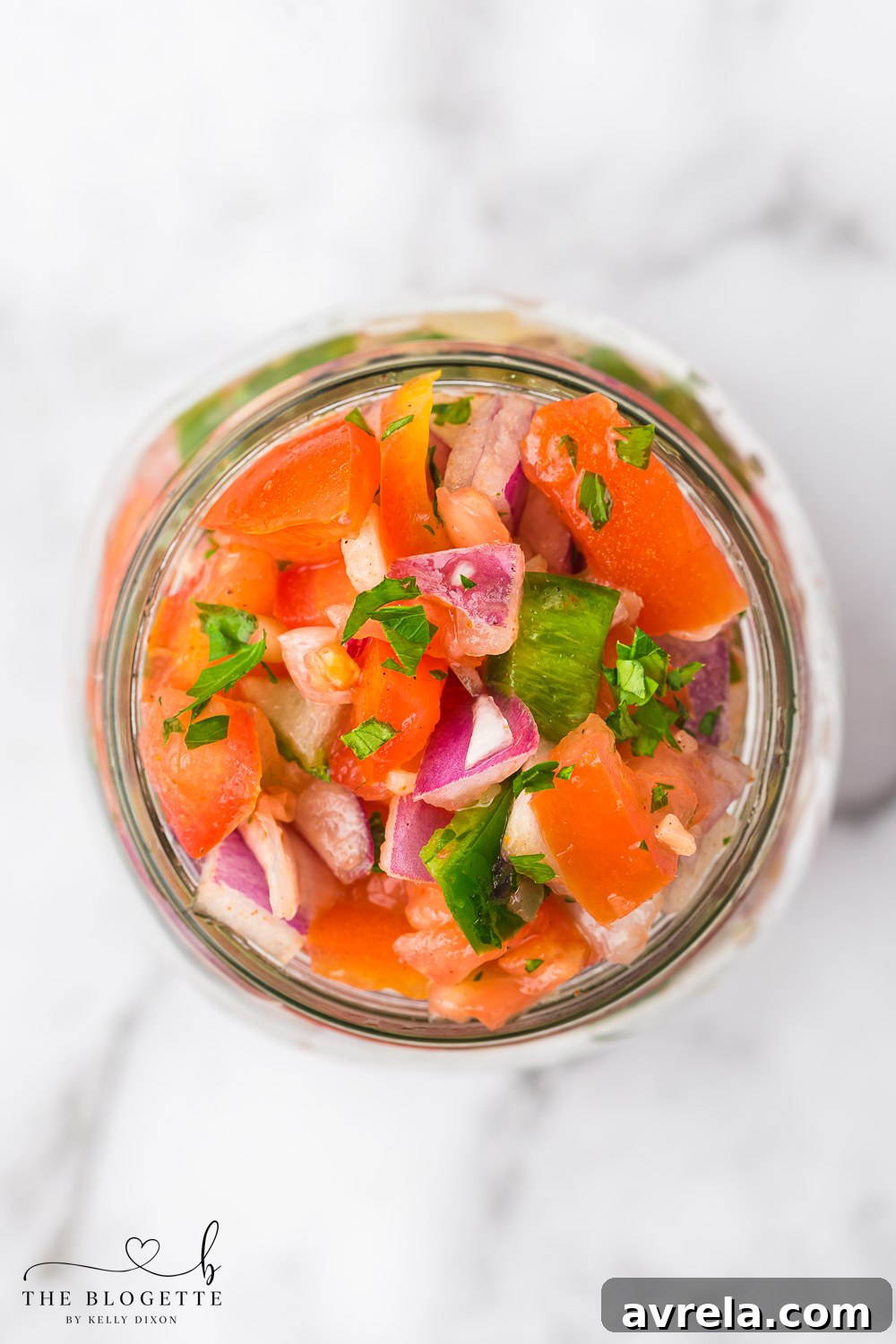 Homemade salsa stored in a mason jar, ready for future enjoyment.