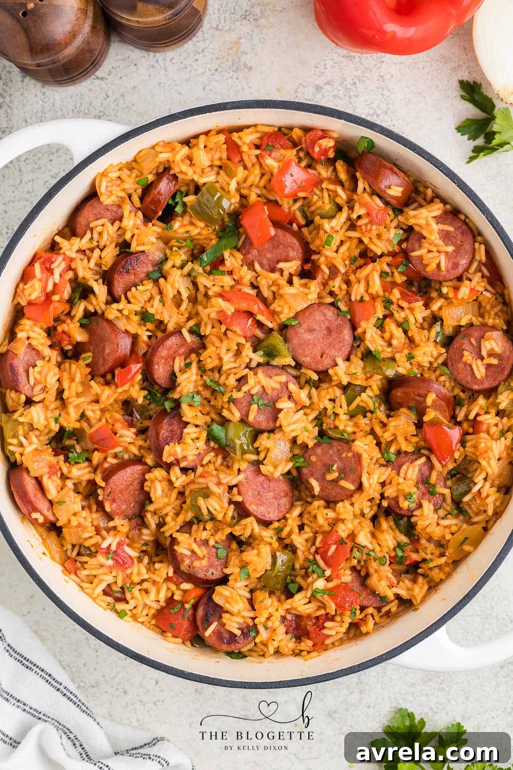 This Sausage and Rice Skillet features smoky sausage sizzled with sweet bell pepper, onions, and garlic in vibrant tomato sauce. A perfect weeknight dinner.