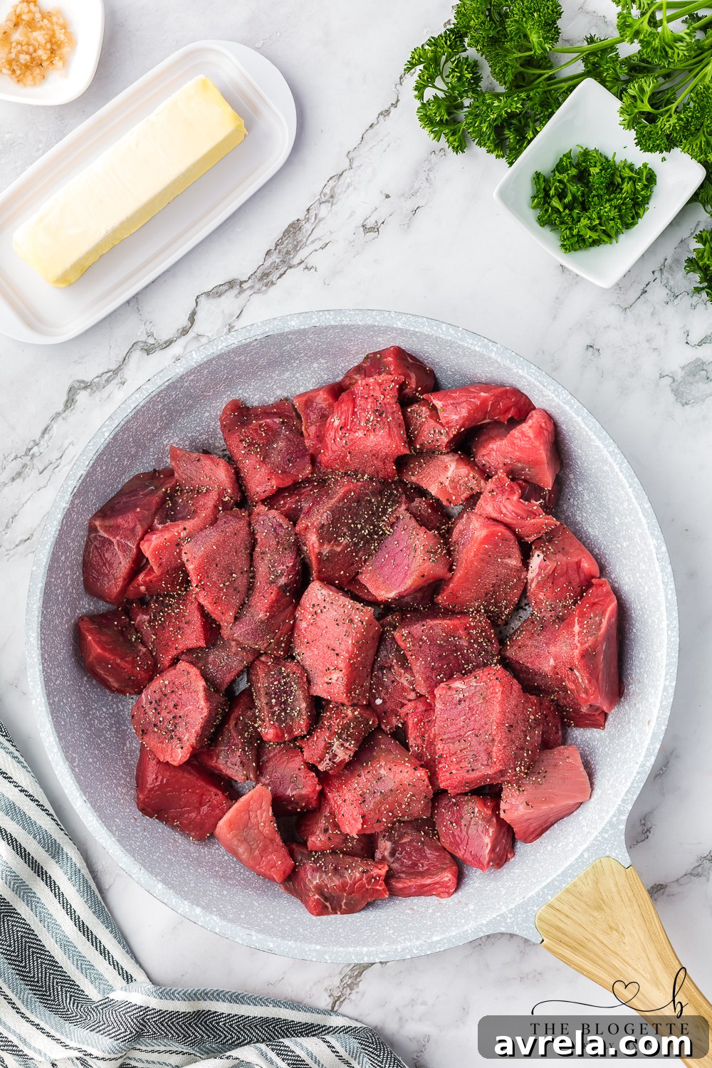 Seasoned steak cubes ready for searing