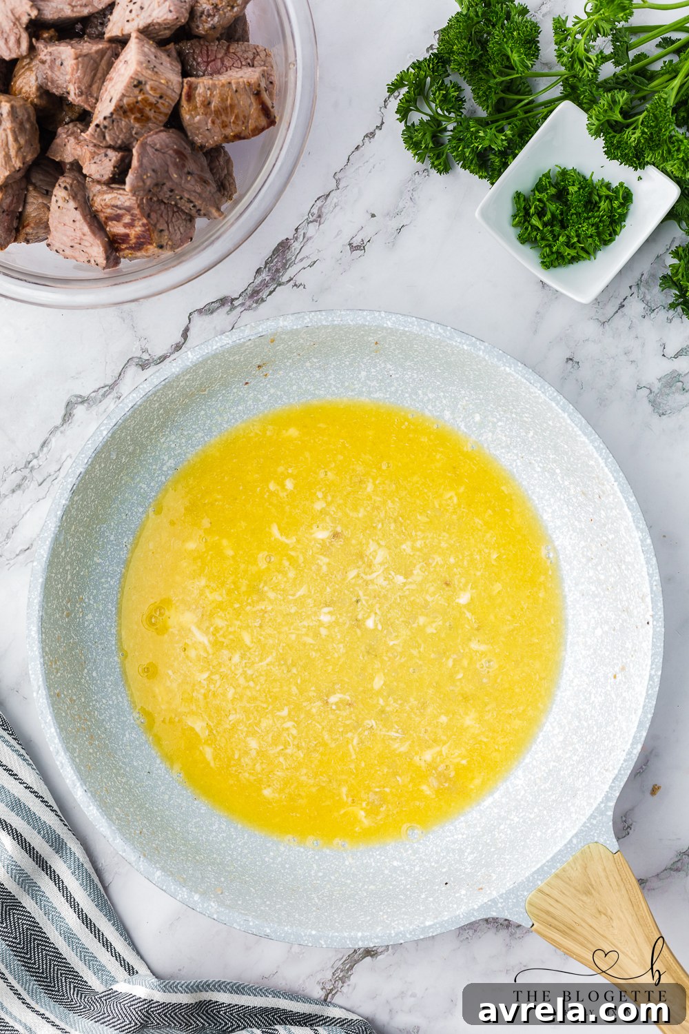 Garlic butter sauce simmering in a skillet