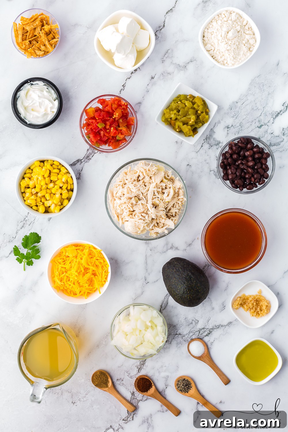 Fresh ingredients laid out on a wooden board, ready for making homemade Chicken Enchilada Soup.