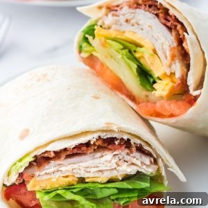 This easy Turkey Ranch Club Wrap is just what your lunch hour needs! Turkey, bacon, and cheese, drizzled with ranch dressing!
