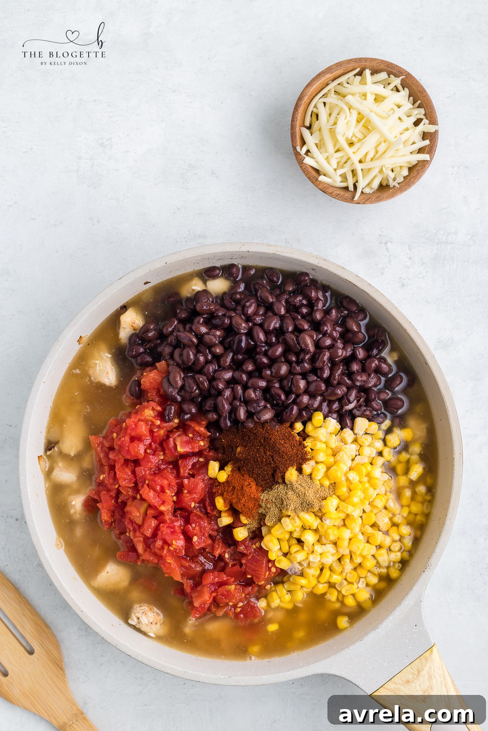 Black beans, diced tomatoes with chilies, and corn added to the skillet with chicken and rice.