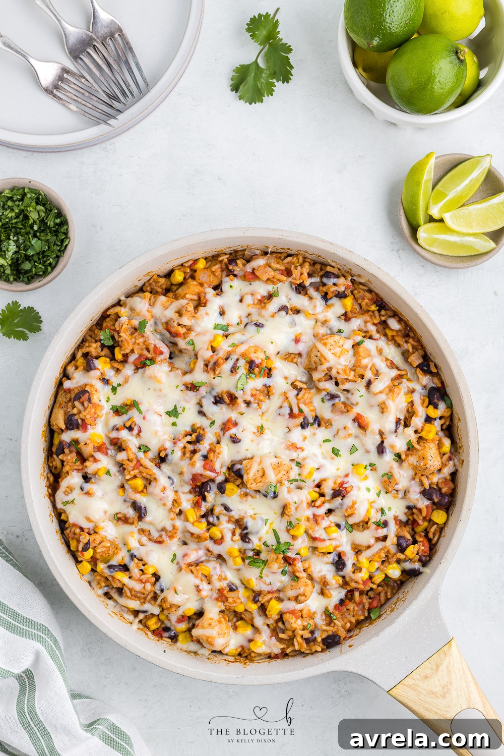 Perfectly melted cheese covering the Tex Mex Chicken and Rice in a skillet.