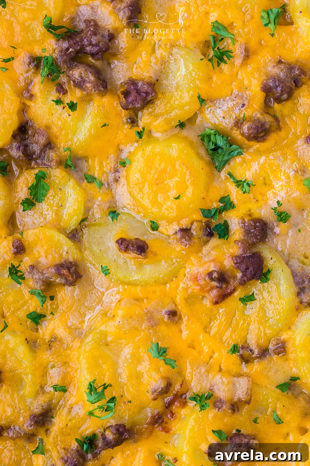 Hearty Beef and Potato Bake 3 Close-up of the Hamburger and Potato Casserole, highlighting the rich, golden-brown crust and bubbling cheese.