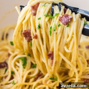 Delicious 30-minute Spaghetti Carbonara, an Italian pasta dish with eggs, cheese, crispy bacon, and garlic. So comforting and incredibly easy to make!