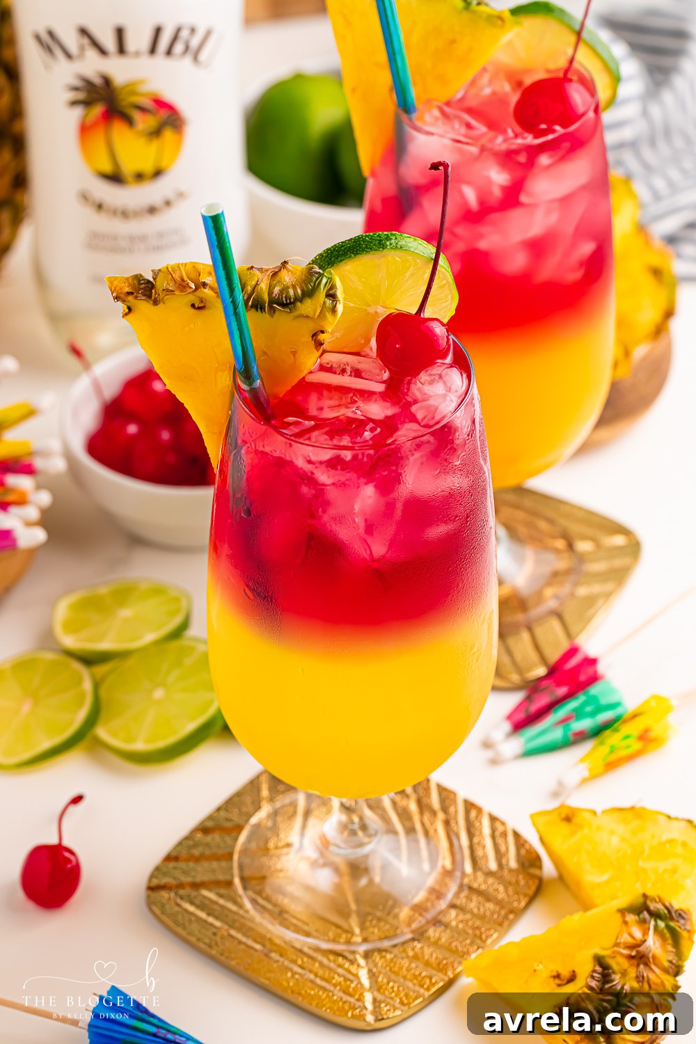 Island Berry Bliss 3 Make a beautiful Malibu Bay Breeze cocktail by layering pineapple juice, Malibu rum, and cranberry juice! Perfect all spring and summer long!